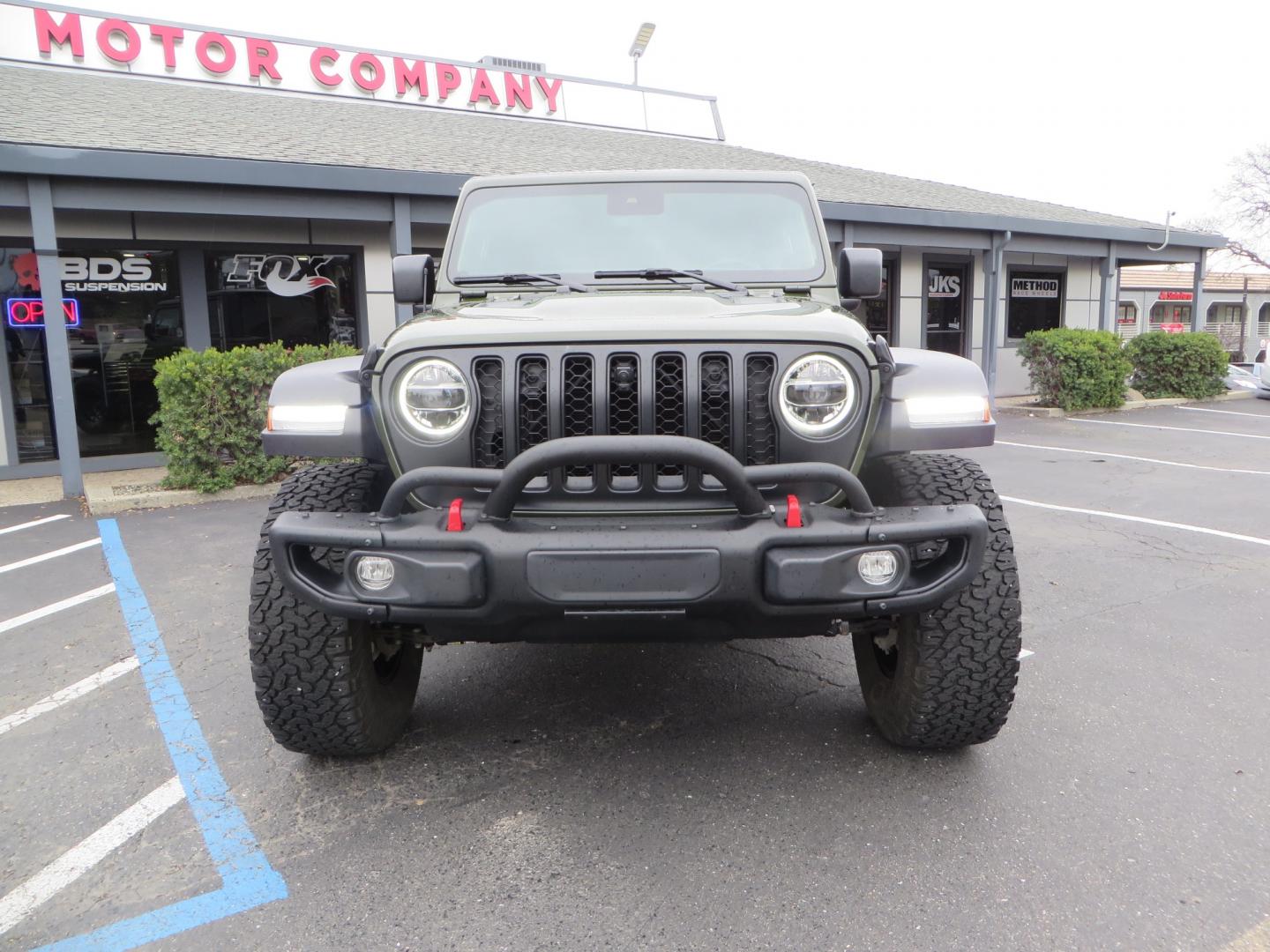 2021 Sarge Green /BLACK Jeep Wrangler Rubicon (1C4HJXCN4MW) with an 2.0L L4 DOHC 16V TURBO engine, 6A transmission, located at 2630 Grass Valley Highway, Auburn, CA, 95603, (530) 508-5100, 38.937893, -121.095482 - Rubicon featuring a Mopar suspension system, Fox shocks, 17" Fuel Wheels, BFG KO2 tires, Maxximus 3 front bumper stinger, Dual exhaust, Bolt hitch lock, Mopar HD tailgate hinge, and a custom cargo platform. - Photo#1